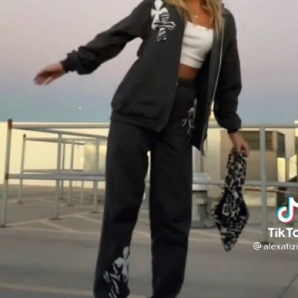 SOLD y2k black zip up hoodie w/cross zebra patches